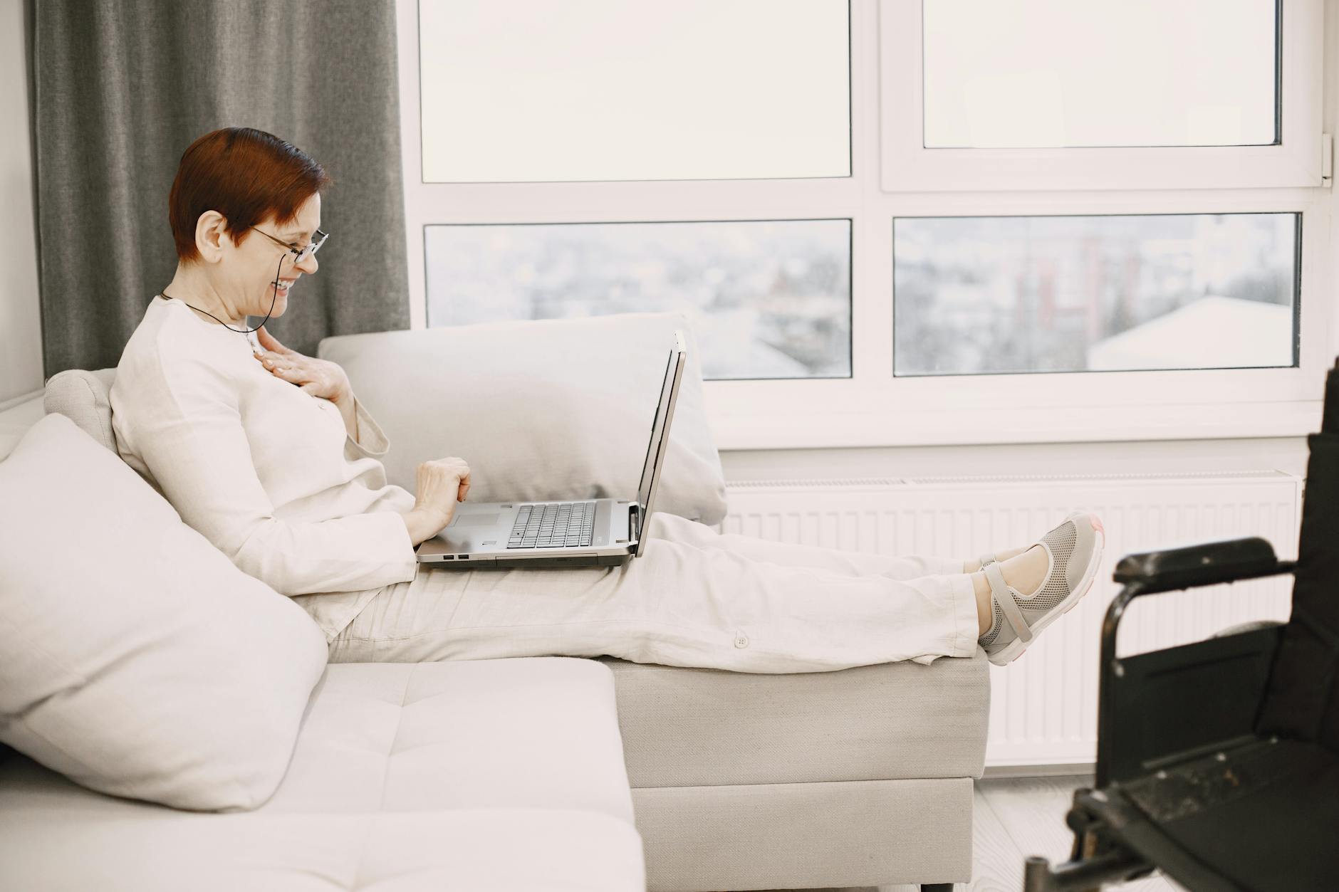 A woman in a relaxed video therapy session at home